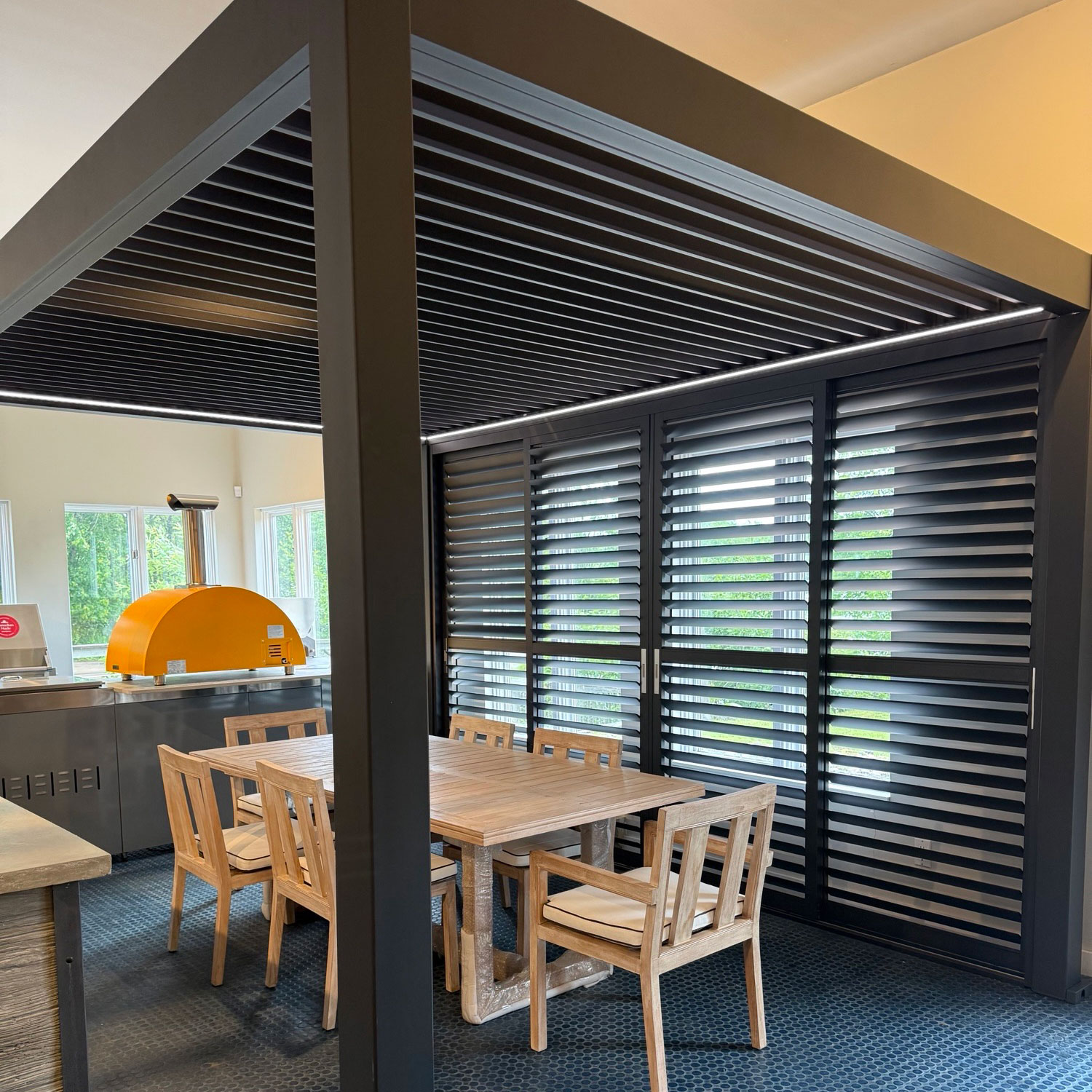 Muskoka powered pergola made out of aluminum set up at the Muskoka BBQ design center